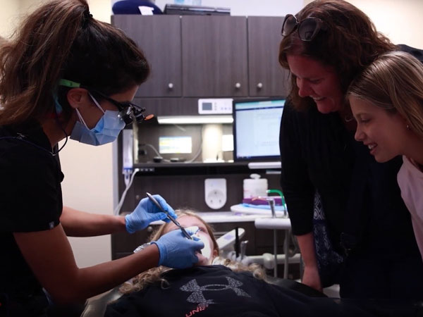 Dentist treating a patient in Brookfield dental office