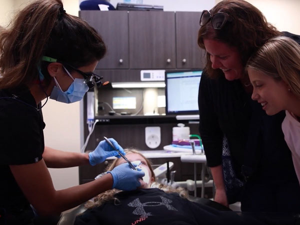 Dentist treating dental patient