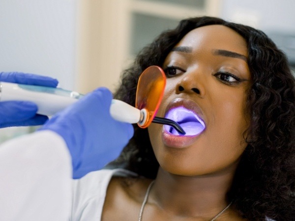 Woman receiving dental bonding treatment