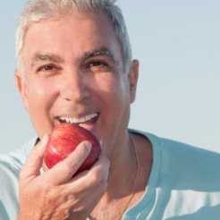 Man eating an apple