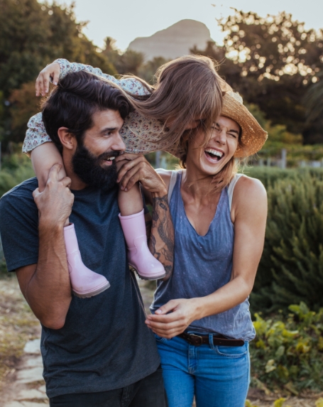 Parents and child with healthy smile thanks to family dentistry