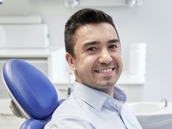 Man smiling during preventive dentistry checkup and teeth cleaning visit