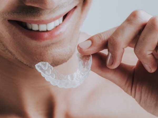 Person placing an oral appliance for sleep apnea