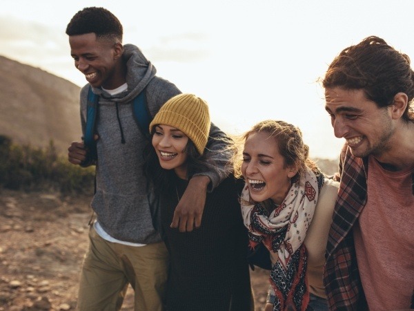 Group of friends smiling together outdoors