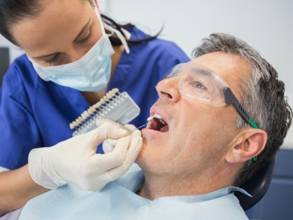 Dental patient examined during veneers consultation