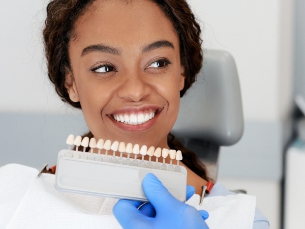 Woman smiling after veneer placement