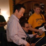 Three people playing Guitar Hero