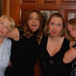 Four women making silly faces at a party