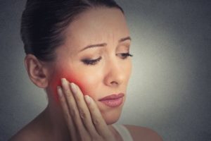 Woman with a throbbing toothache