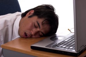 man drooling on wooden table