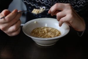 man eating chicken soup